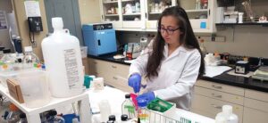 A lady testing the samples in the lab